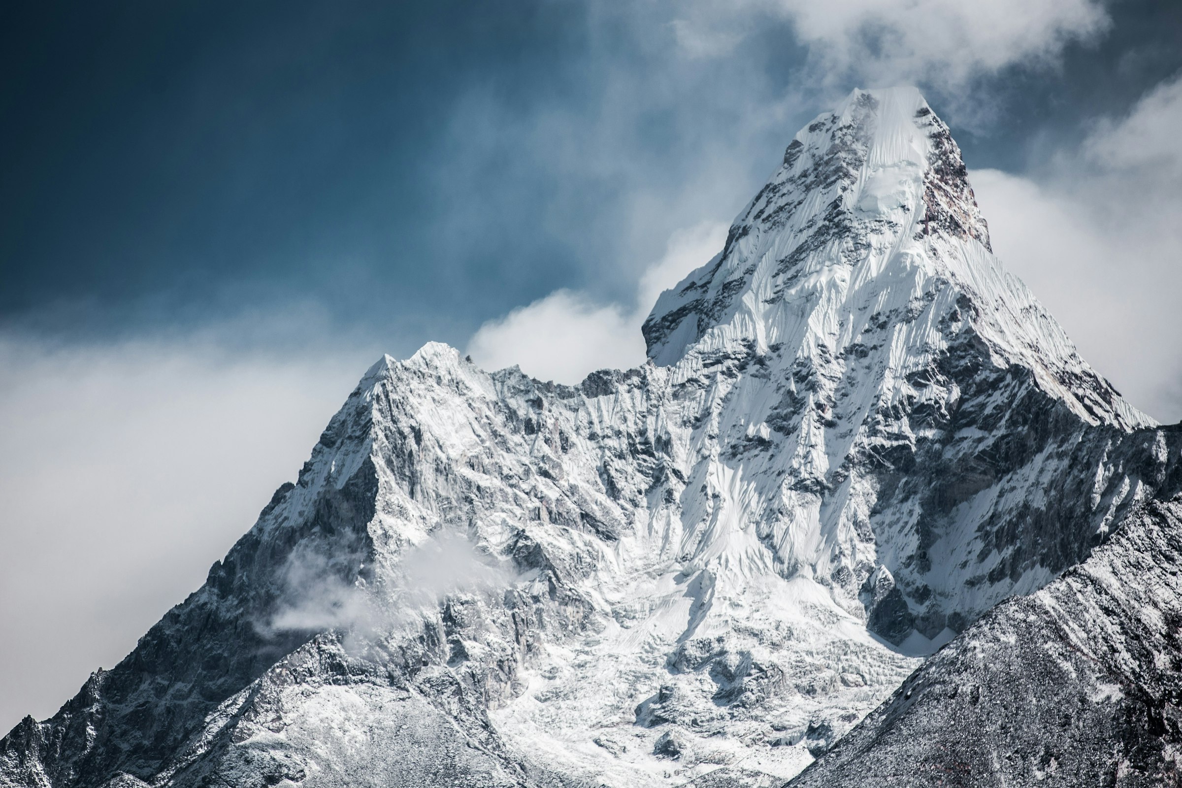 Snow-capped Himalayan peaks at dawn above a glacial valley in Nepal