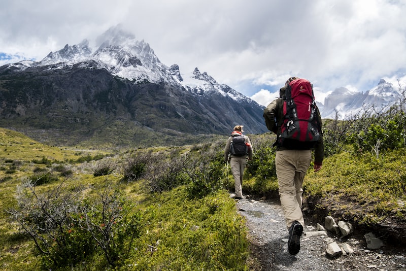 Trekking gear laid out on a wooden floor before a Nepal trek